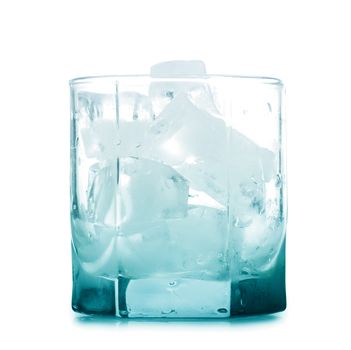 Empty glass with ice cubes isolated over white background
