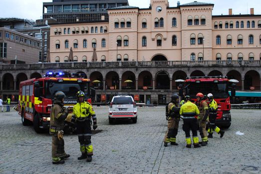 Firemen organizing emergency work at Youngs Square (Youngstorget) shortly after the terror bomb attack in Oslo 22.07.2011.