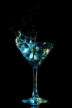 alcohol splash on black background