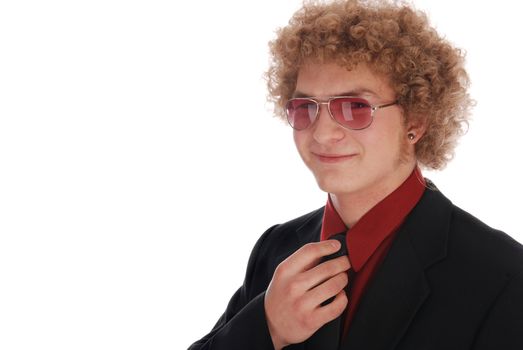 Young businessman fixing his tie