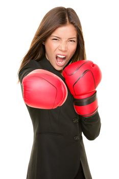 Business woman boxing punching towards camera ready to fight. Strength, power or competition concept image of beautiful strong Asian / Caucasian businesswoman isolated on white background.