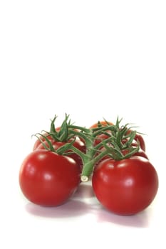 a panicle tomatoes on a white background