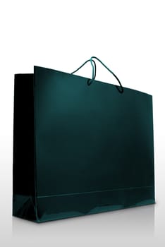 Green  paper shopping bag on white background