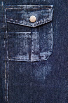 blue denim with a pocket. Abstract background