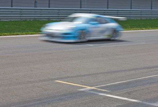 Race car passing finnish Line