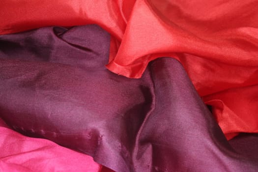 red, purple and pink silk as a background