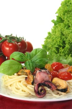 Spaghetti with fried vegetables and seafood