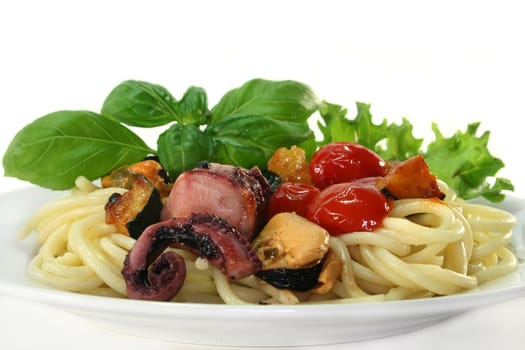 Spaghetti with fried vegetables and seafood