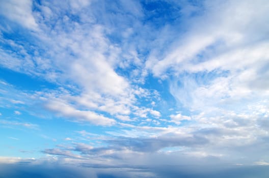 blue sky background with tiny clouds