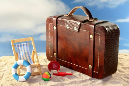 Deck chair and sun umbrella on a sandy beach