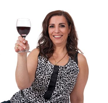 Smiling mature woman with a glass of red wine, isolated on white background.
