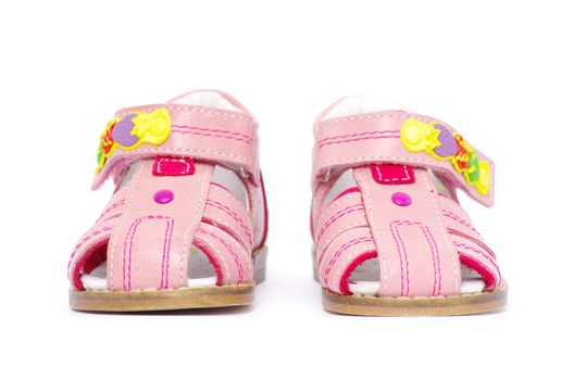 pink child's sandals isolated on white