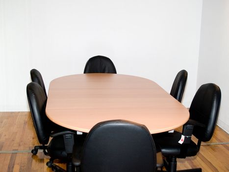 Confrence room with table and chairs