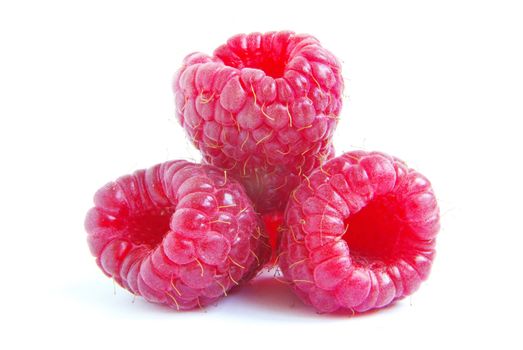 Ripe raspberry on a white background