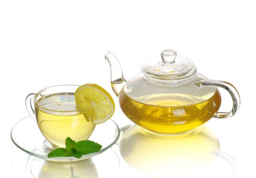 Tea being poured into glass tea cup
