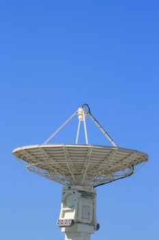 Big satellite dish over clear blue sky.
