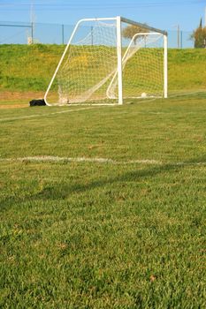 Soccer gate on a grass soccer field.
