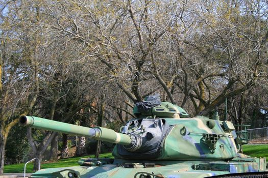 U.S. Military tank parked in a veterans memorial center.
