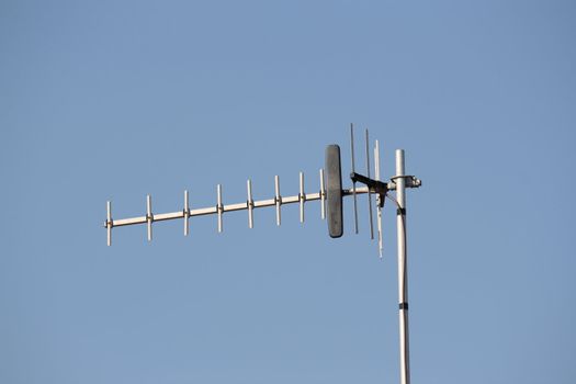 tv aerial against a clear blue sky