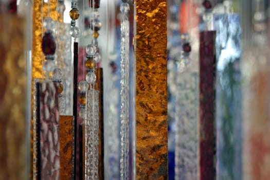 Hanging abstract glass peaces in different colors.