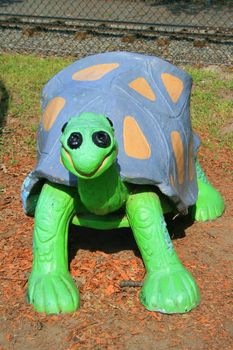 Close up of a turtle child bench.
