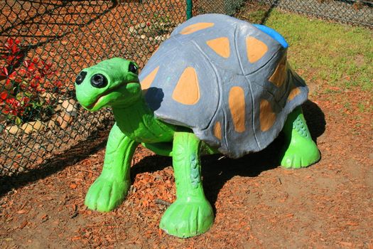 Close up of a turtle child bench.
