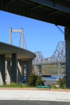 Two tall bridges built over a river.
