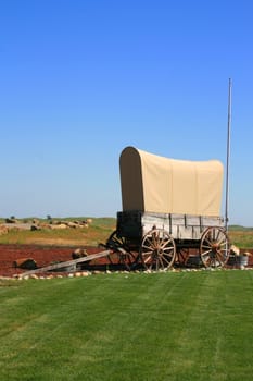 Close up of a wagon on a grass.
