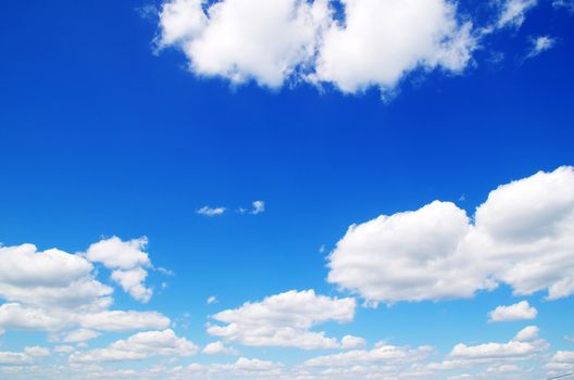 blue sky background with tiny clouds