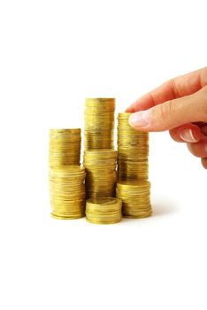 Hand put coin to money staircase isolated on white background
