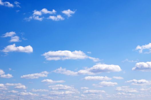 Blue sky background with a tiny clouds       