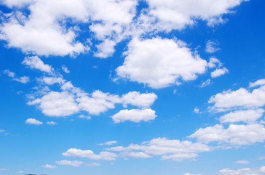 blue sky background with tiny clouds