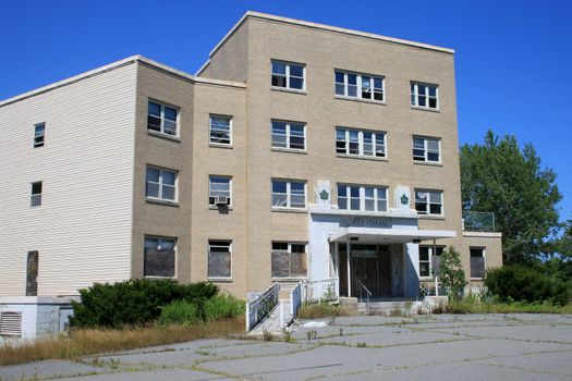 Abandonned hospital with broken windows by vandals