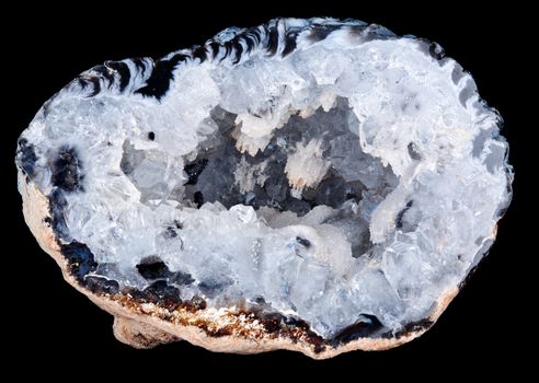 Macro image of a geode rock with the crystalline shapes inside the geode clearly visible and in focus