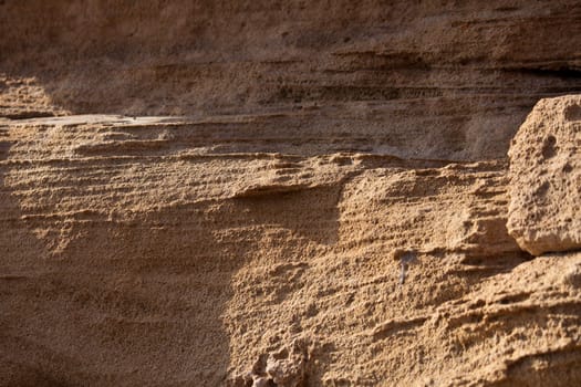 photo texture rocky cliff of sandstone brown