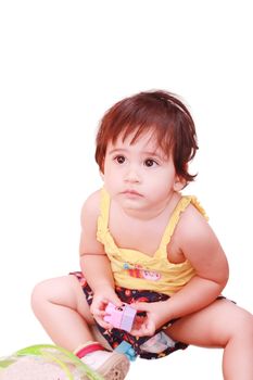 baby plays with toy over white background