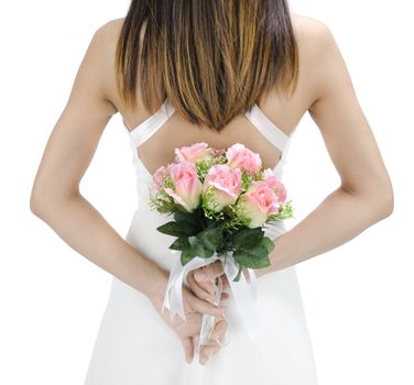 Bride holding her bouquet behind her back