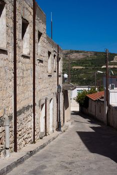 Picture a narrow street in the mountain village