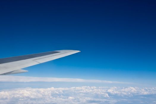 the view from the airplane at the blue sky