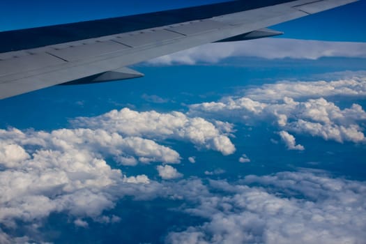 the view from the airplane at the blue sky