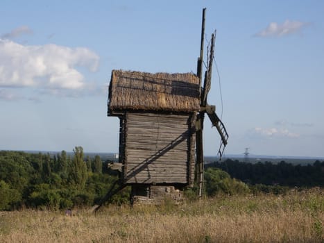 Lonely mill near the forest