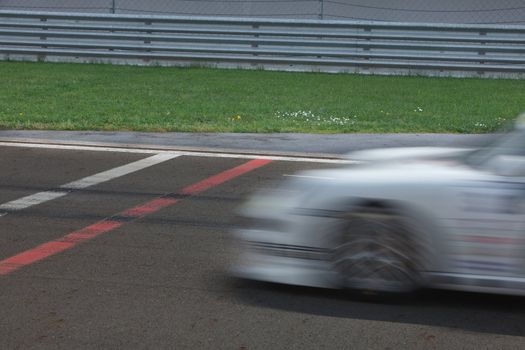 Race car passing finnish Line.