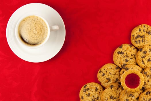 Coffee and cookies on a red background
