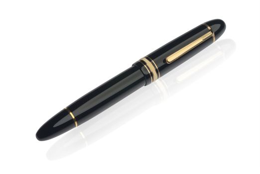 Closed german fountain pen on reflective surface, isolated with clipping path