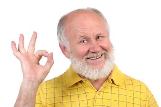 senior funny bald man in yellow t-shirt is shows gestures and grimaces