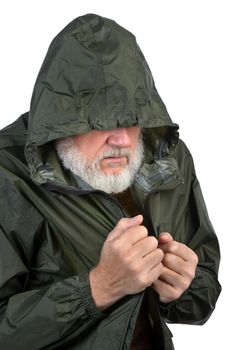 pathetic senior man in green waterproof jacket