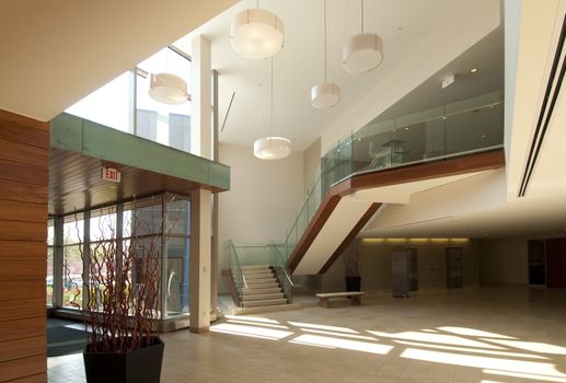 Modern office building lobby in marble, glass and mahogany