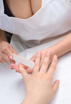 Procedure of making manicure using nailfile
