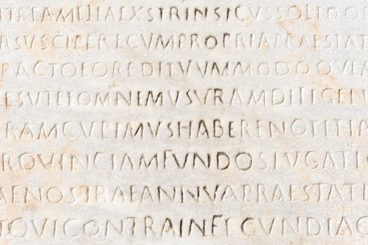Closeup of ancient latin text carved on marble, Ephesus, Turkey