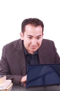 Businessman with amazed expression using a laptop